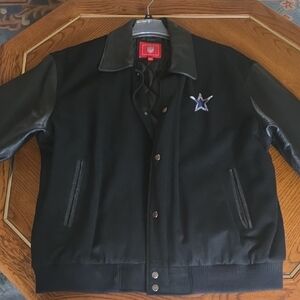 Dallas Cowboys varsity jacket with black leather sleeves and a wool blend body.
